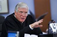 Judge Donald Mosley asks a question to attorneys during a bail hearing for Leonard Schwingdorf in District Court Wednesday, Sept. 28, 2011. Schwingdorf is among defendants facing charges in connection with distributing medical marijuana.