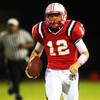 Photo: Liberty quarterback Kai Nacua takes off on a keepe Photo: Liberty quarterback Kai Nacua takes off on a keepe