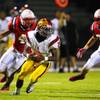 Del Sol running back Chris Marshall is chased by Liberty linebackers Jared Tuilagi, left, and Taylor D'Aquisto during their game Saturday, October 2, 2011. Liberty won 34-0.