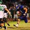 Photo: Moapa's Conner Mortensen carries the ball during a Photo: Moapa's Conner Mortensen carries the ball during a