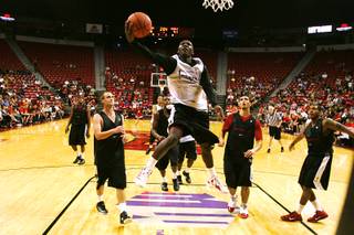 Reggie Smith drives to the basket during the Rebels' first scrimmage Sunday, Oct. 16, 2011.