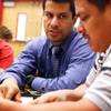 Western High School English teacher Edgar Acosta helps Jose Antonio Miranda during class for English-as-a-second-language parents taught after school at Western High School on Tuesday, Nov. 15, 2011.