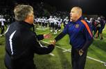 Bishop Gorman coach Tony Sanchez and Palo Verde coach Darwin Rost shake hands after their game Friday, Nov. 18, 2011, at Bishop Gorman. Gorman won the game, 35-7, and will play for the state title.