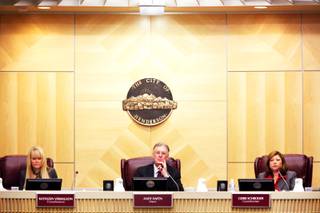 Henderson Mayor Andy Hafen, center, flanked by city council members Kathleen Vermillion, left, and Gerri Schroder, right, listen during the council's meeting Tuesday, Nov. 29, 2011,  in which the council unanimously appointed Josh M. Reid, U.S. Senate Majority Leader Harry Reid's son, to be the next city attorney.