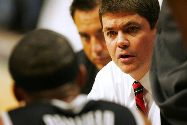 UNLV head coach Dave Rice talks to his players during a time out in their game against Illinois Saturday, Dec. 17, 2011 at the United Center in Chicago. The Rebels beat the 19th-ranked Illini 64-48.