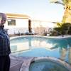 Photo: North Las Vegas homeowner Rex Austin looks at his 