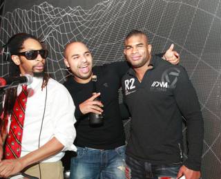 Alistair Overeem, with Lil Jon and Sidney Samson, celebrates his UFC 141 victory at Surrender on Dec. 30, 2011.