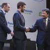 Shiro Kitajima (R), president of Panasonic Electronics Marketing Company of North America, shakes hands with recording artist Justin Timberlake (C) and Myspace CEO Tim Vanderhook during a Panasonic news conference for the 2012 International Consumer Electronics Show (CES) in Las Vegas, Nevada, January 9, 2012.  Vanderhook and Timberlake helped introduce Myspace TV, a social TV service that will be available on Panasonic televisions.