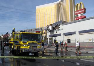 Clark County firefighters responded to a two-alarm fire Monday morning at the McDonald's located across the street from Mandalay Bay. No one was injured.
