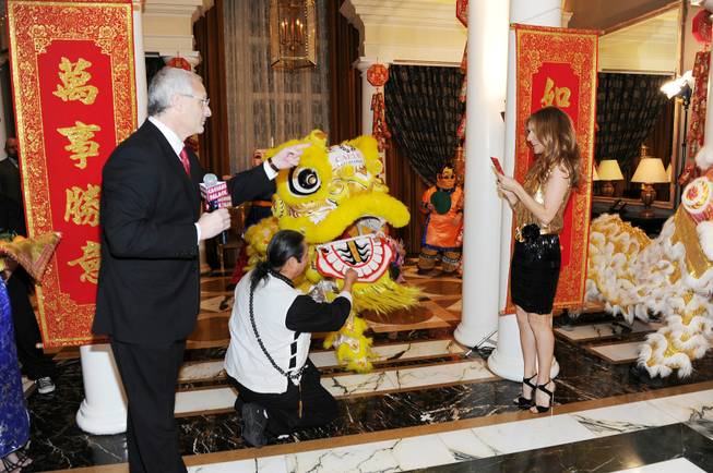 Caesars Entertainment Regional President Gary Selesner and Celine Dion celebrate ...