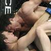 Photo: Chael Sonnen, top, pounds away on Michael Bisping,
