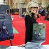Photo: Photographer Lindsay McCrum poses with a copy of h