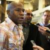 Photo: Boxer Floyd Mayweather Jr. speaks with reporters a