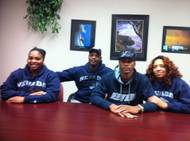 Las Vegas High quarterback Hasaan Henderson poses for a picture with his family (dad Alzim Henderson, mom Kishombi Henderson and sister Mykiera Henderson) after signing a national letter of intent Feb. 1, 2012, to play football at Nevada.