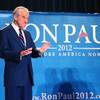 Republican presidential candidate U.S. Rep. Ron Paul, R-Texas, gestures for the audience to settle down after taking the stage during a campaign event at the Four Seasons Las Vegas on Wednesday, Feb. 1, 2012.