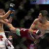 Photo: Bantamweight fighter Renan Barao lands a kick to t