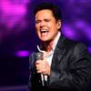 Donny Osmond, shown here performing at the Flamingo, picks the New York Giants to win the Super Bowl. Osmond won this season's Las Vegas celebrity football-picking contest.
