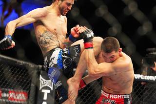 Carlos Condit connects with a flying knee to Nick Diaz during their interim welterweight championship bout Saturday, Feb. 4, 2012 at the Mandalay Bay Events Center. Condit won a unanimous decision and will likely face Georges St. Pierre in November.