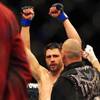 Photo: Carlos Condit raises his arms after the fifth roun