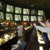Andrew Gordon, right, of Miami celebrates a New Giants touchdown as he watches the Super Bowl at the Las Vegas Hotel's Superbook Sunday, February 5, 2012.