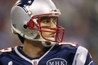 New England Patriots quarterback Tom Brady looks downfield during the second half of Super Bowl XLVI against the New York Giants in Indianapolis on Sunday, Feb. 5, 2012.