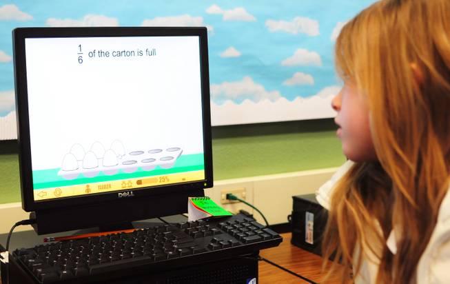 Sewell Elementary School fifth-grader Tyler Lefko, 10, works through math problems on the "ST Math" computer software developed by California-based nonprofit education group Mind Research Institute. The virtual software teaches abstract math concepts using visual animations and games.