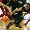 Photo: UNLV guard Justin Hawkins gets the ball away from 