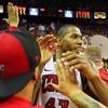 Photo: UNLV forward Mike Moser greets fans after their 65