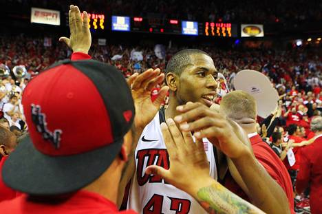 UNLV forward Mike Moser greets fans after the Rebels' 65-63 win over San Diego State on Saturday, Feb. 11, 2012.