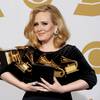 Photo: Adele holds her six awards backstage at the 54th A Photo: Adele holds her six awards backstage at the 54th A