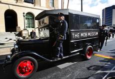 Members of the San Diego Police Museum Association arrive in a 1932 "paddy wagon" during the grand opening of The Mob Museum in Las Vegas, Tuesday February 14, 2012. The museum, in a former federal courthouse and post office, is one of 14 sites in the nation that hosted the 1950-51 U.S. Senate Special Committees to investigate Crime in Interstate Commerce, also known as the Kefauver hearings.