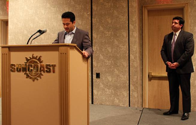 Alden Crowley, founder of the Another Joy Foundation, announces the donation of 162,000 textbooks to the Clark County School District as Javier Trujillo, the chairman of the Latin Chamber of Commerce board of directors, watches from the stage. The announcement came Feb. 17, 2012, at the monthly luncheon for the chamber, which collaborated with Crowley.