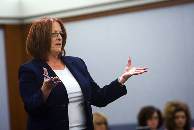 Chief Deputy District Attorney Maria Lavell asks a question during a preliminary hearing in District Court Tuesday Feb. 28, 2012. Benjamin Gerard Hawkins, a Gainesville, Fla., teacher who was on vacation, is facing charges of involuntary manslaughter in connection with the death of another tourist after an altercation at O'Sheas in July.