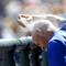 Toronto Blue Jays' Chris Woodward sprays his head with sun block during a spring training baseball game between the Detroit Tigers and the Toronto Blue Jays, Monday, March 5, 2012, in Lakeland, Fla.