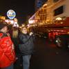 A race fan cheers during a NASCAR hauler parade on Las Vegas Boulevard Thursday, March 8, 2012.