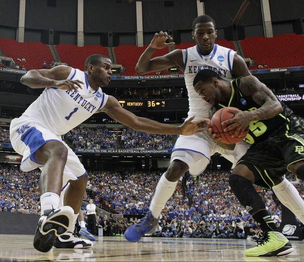 Baylor's Pierre Jackson (55) drives against Kentucky's Michael Kidd-Gilchrist, center, and Kentucky's Darius Miller during the first half of an NCAA tournament South Regional finals college basketball game Sunday, March 25, 2012, in Atlanta.
