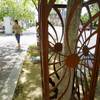 Photo: A pedestrian passes by tree guards outside the His Photo: A pedestrian passes by tree guards outside the His