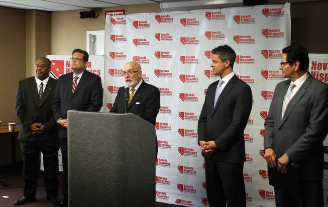 Niger Innis, national spokesman for Congress of Racial Equality, Alfonso Aguilar, executive director of Latino Partnership for Conservative Principles, Adam Stryker, director of the Nevada chapter of Americans for Prosperity and Michael Barrera, western regional director of Libre Initiative (left to right) listen as Nelson Santiago, spokesperson for Nevada Hispanics, announces the formation of the new civic engagement organization dedicated to promoting conservative politics among Latinos.