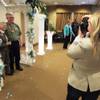 A photographer snaps a picture during a wedding vow renewal ceremony at Las Ventanas. Sixteen couples – who have been married a combined 937 years, or about 58 years each on average – renewed their vows during a ceremony hosted by the retirement community on Wednesday, June 6, 2012. A photographer snaps a picture during a wedding vow renewal ceremony at Las Ventanas. Sixteen couples – who have been married a combined 937 years, or about 58 years each on average – renewed their vows during a ceremony hosted by the retirement community on Wednesday, June 6, 2012.