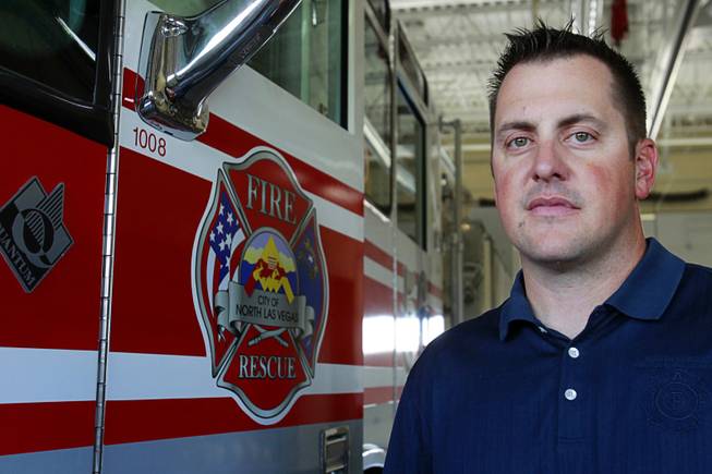 North Las Vegas Fire Capt. Jeff Hurley poses by a ladder truck at Fire Station 56 near Aliante Parkway and I-215 in North Las Vegas Tuesday, July 10, 2012. The station is not always open or open with reduced staff due to staffing problems, Hurley said. The station was open on Tuesday but without a rescue unit.