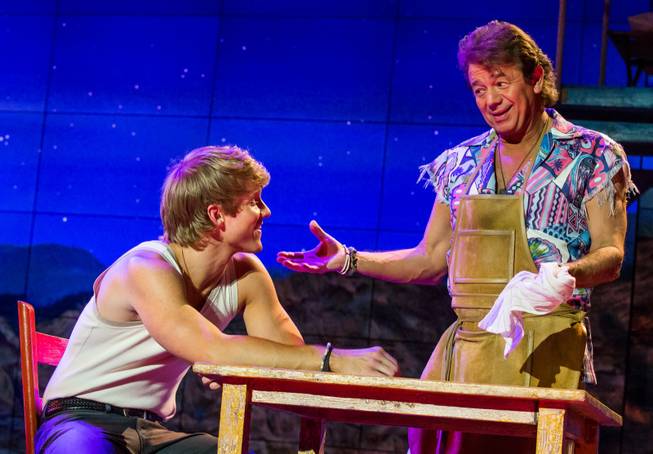 Marshal Kennedy Carolan as Tanner and Adrian Zmed in a scene from "Surf the Musical" at Planet Hollywood.