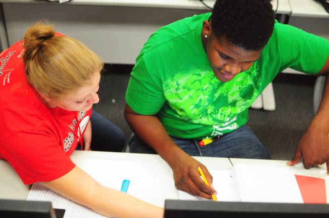 Tutor Megan Bavaro helps Sevaughn Thomas, 18, at UNLV's Summer Bridge program on Tuesday, July 17, 2012. The new program helps incoming freshmen avoid costly remedial math courses by preparing them for five weeks over the summer to pass a math proficiency exam that places them into a college-level math course.