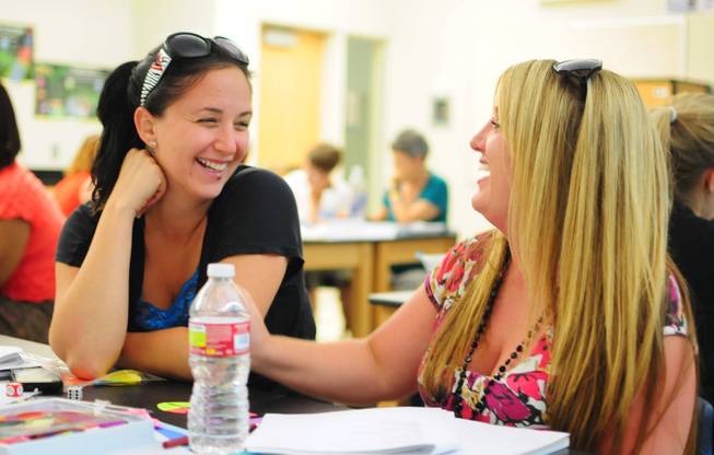 From left, Clark County School District teachers Randi Kreitzer and Meredith Fretz participate in a summer training session on Tuesday, July 24, 2012. More than 5,000 teachers are taking unprecedented professional development opportunities over the summer in a district-wide initiative to boost student achievement in the upcoming school year.
