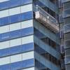 A firefighter lowers a stranded window washer down the side of Vdara on Wednesday, July 25, 2012. A firefighter lowers a stranded window washer down the side of Vdara on Wednesday, July 25, 2012.