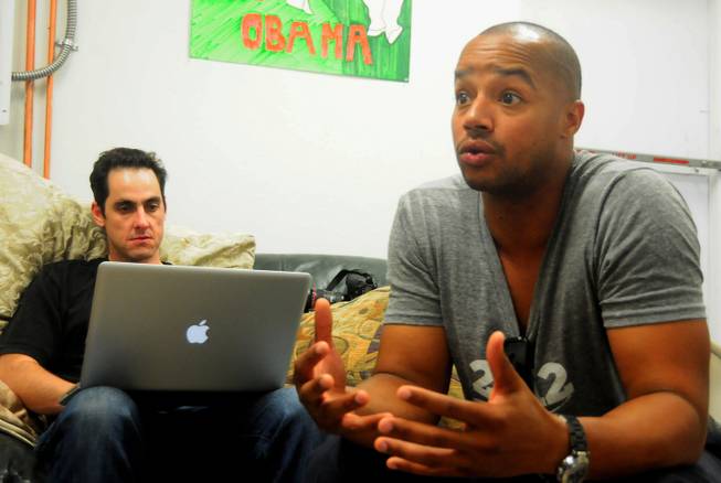 Actor Donald Faison, left, participates in media interview at a Barack Obama presidential campaign office in Las Vegas on Saturday, July 28, 2012. Faison and co-star Zach Braff from the popular TV sitcom "Scrubs" were in town to support volunteers canvassing in the central valley. To the right of Faison is Jason Karsh, digital director of Obama's Nevada campaign offices.