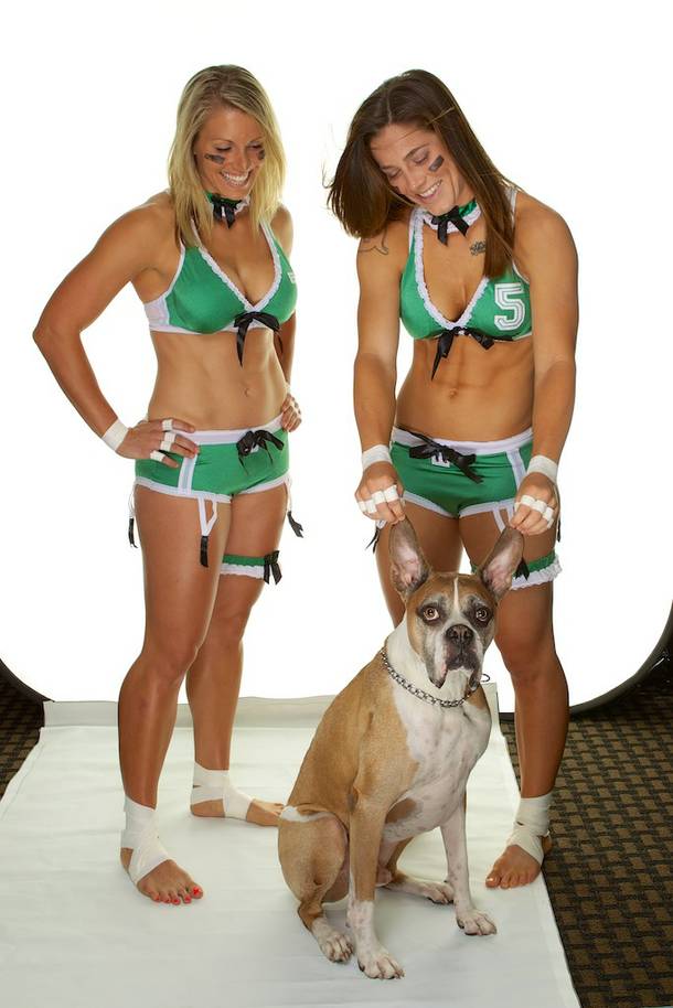 Las Vegas Sin teammates Carmen Bourseau and Nikki Johnson (in Regina Rage uniforms) with Lingerie Football League mascot Halftime.