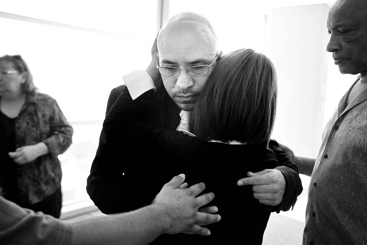 Arturo Martinez-Sanchez is consoled by his family and friends Aug. 27, 2012, after attending a Bryan Clay hearing at the Regional Justice Center in Las Vegas. Clay is the accused killer of Martinez-Sanchez’s wife and daughter.