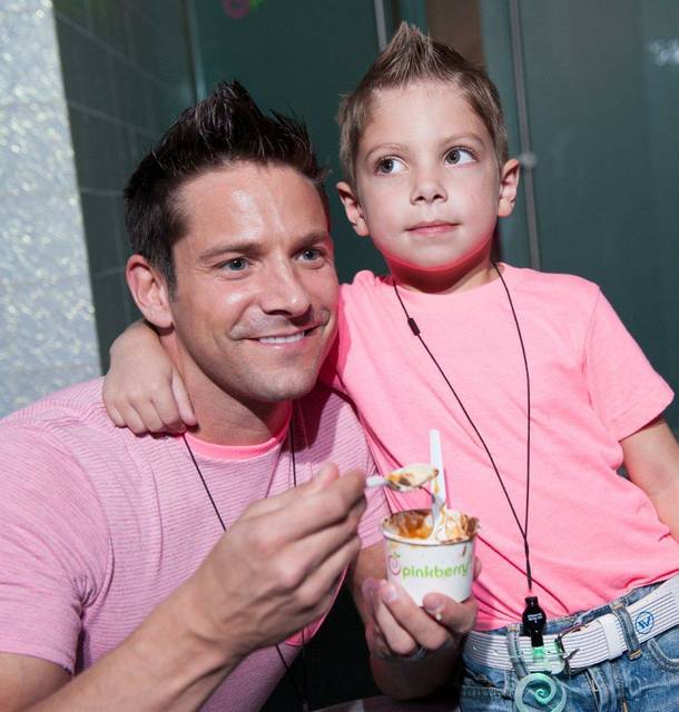 Jeff Timmons and his son attend the Pinkberry opening at Crystals in CityCenter on Thursday, Aug. 30, 2012.