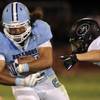 Photo: Centennial running back Coby Newton protects the b Photo: Centennial running back Coby Newton protects the b