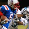 Photo: Liberty running back Niko Kapeli shoves away Canyo Photo: Liberty running back Niko Kapeli shoves away Canyo